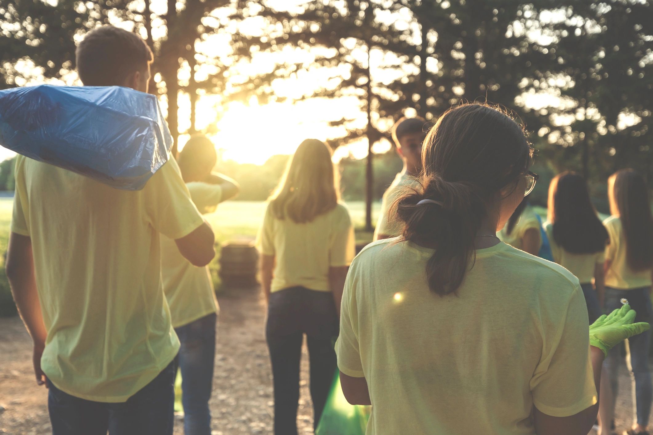 Young volunteers participating in community cleanup and recycling