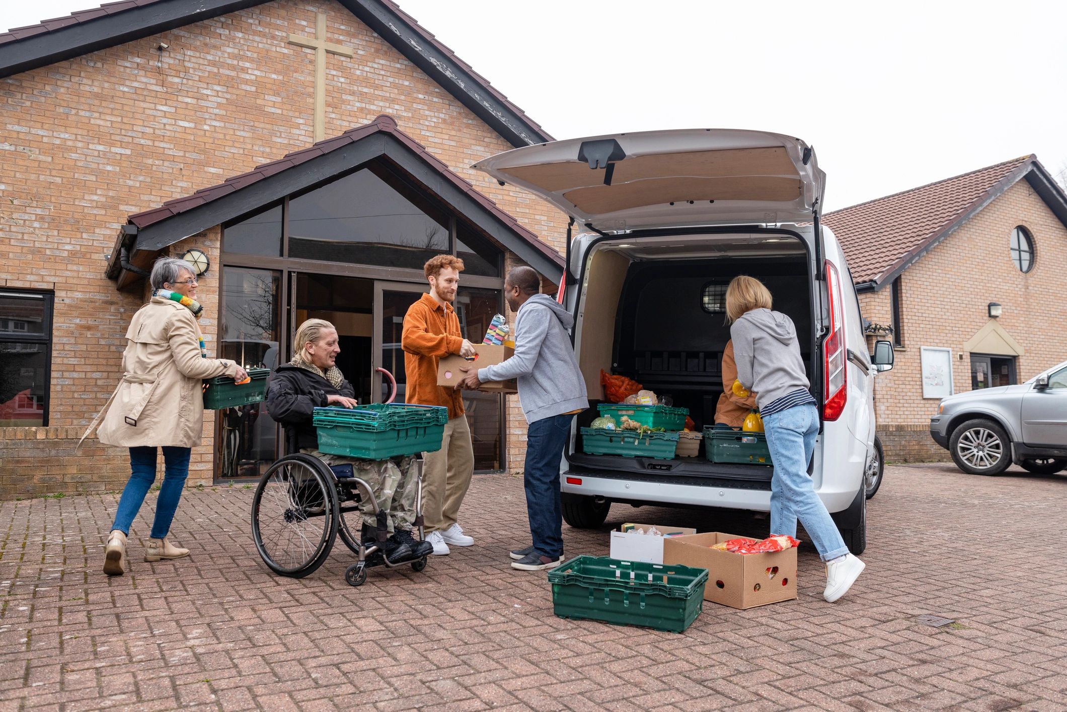 Food donations being unloaded by volunteers