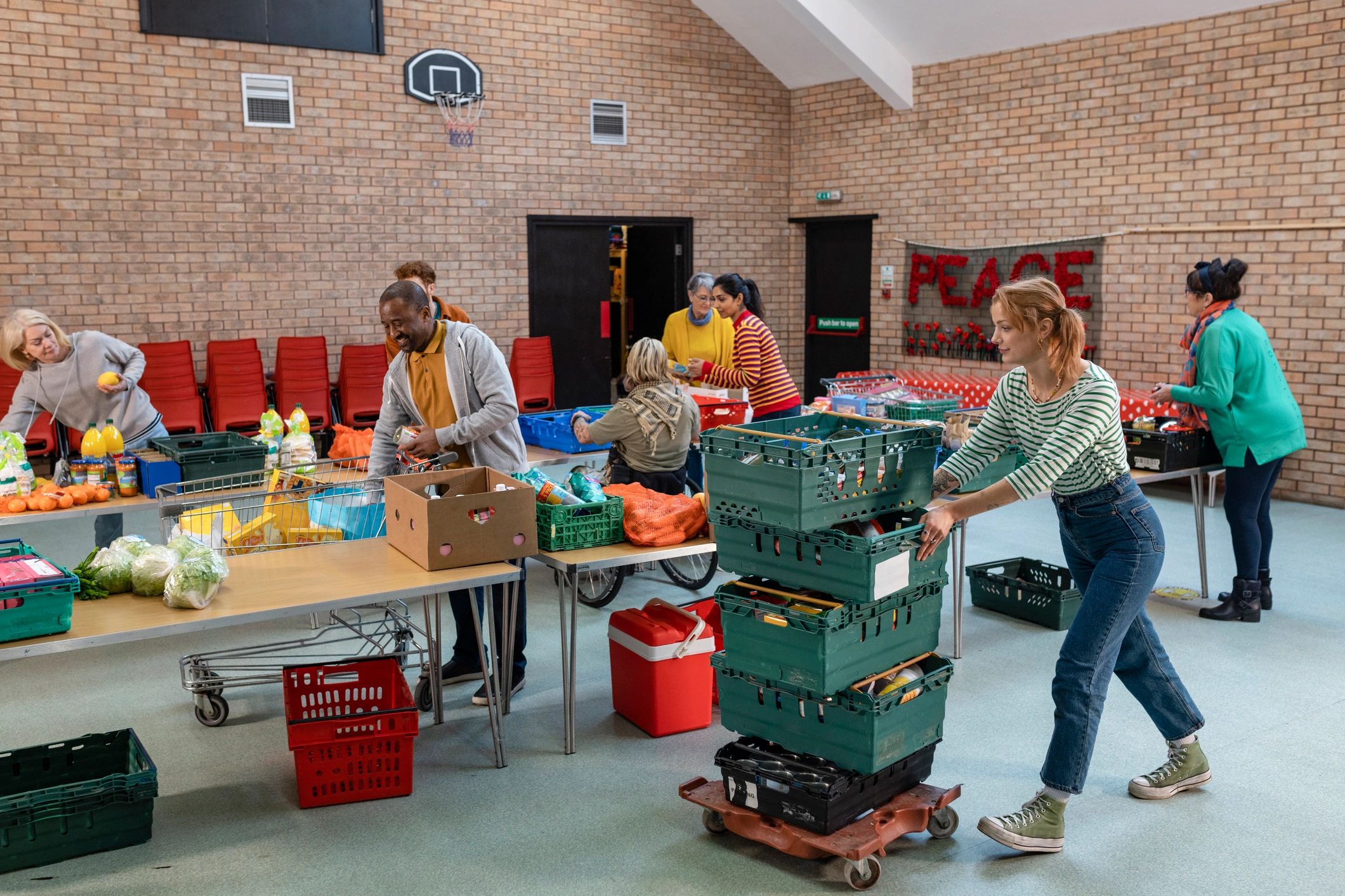 Volunteers organizing food donations indoors